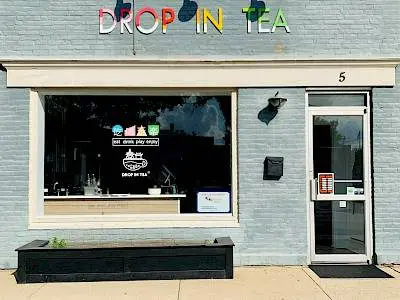 Store front sign of Drop in Tea