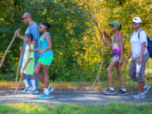 A group of people enjoying the attractions while walking on a trail in Oxford.