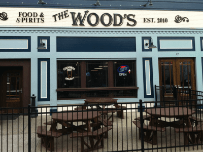 A bar with benches and tables outside