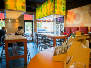 Inside SoHi restaurant with tables and chairs