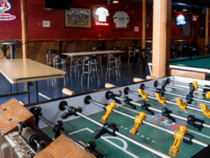 A table football game in the middle of a room.