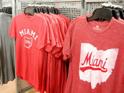 A rack of red shirts with the state of miami on them.