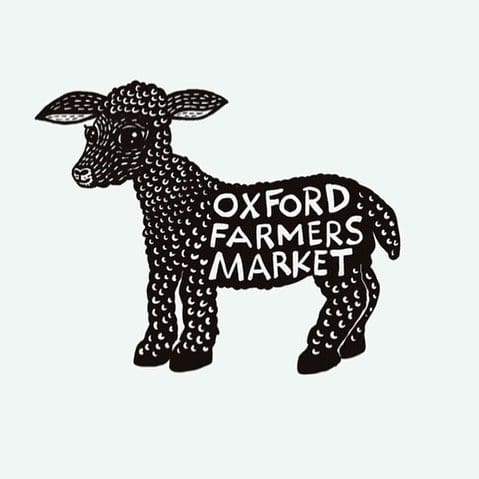 Black and white sheep with the words Oxford Farmers Market in the middle