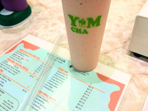 photo of a Yum Cha smoothie and menu on counter