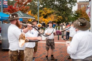 an Oktoberfest themed band playing instruments together