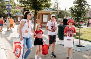 photo of a mon and three kids walking with shopping bags Uptown Oxford