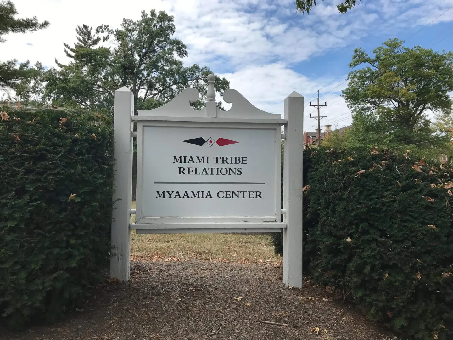 Photo of white sign outside of Bonham House "Miami Tribe Relations | Myaamia Center"