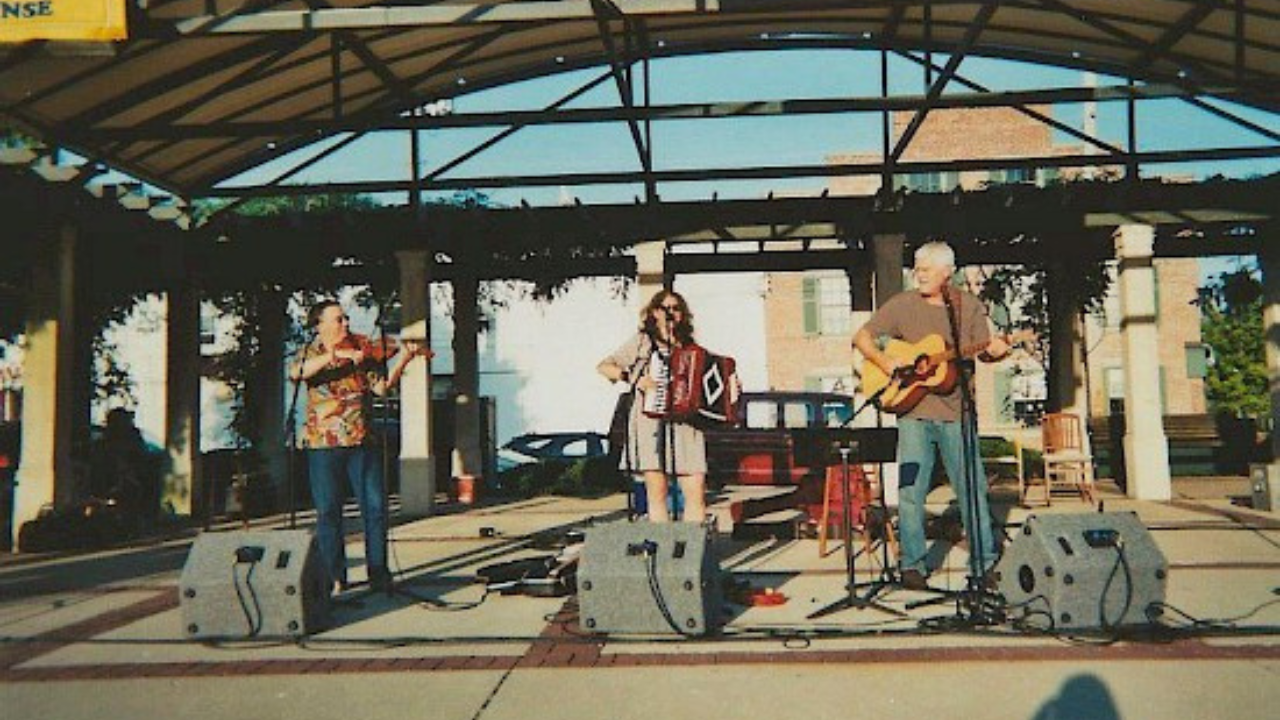 John Kogge performing on the Uptown stage with his band