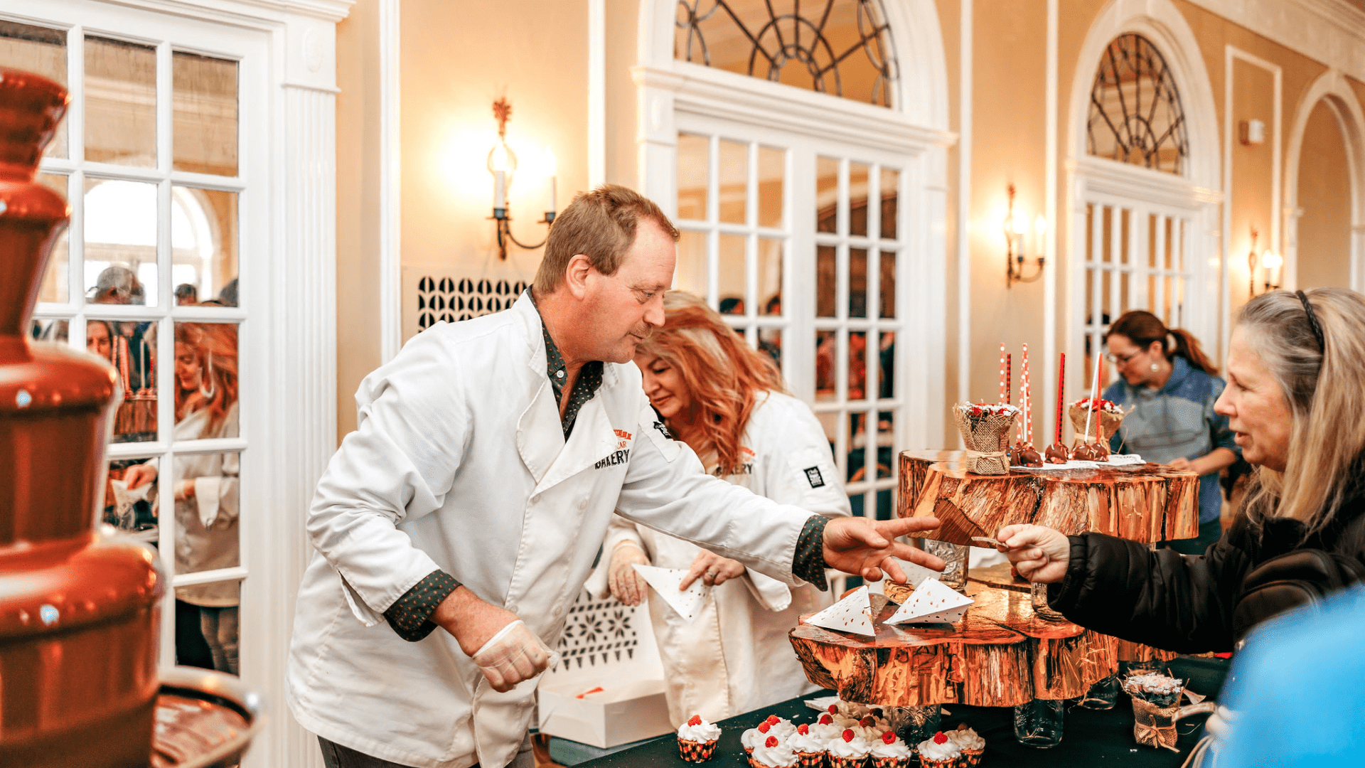 Chocolate confectioner taking a ticket for a tasting.