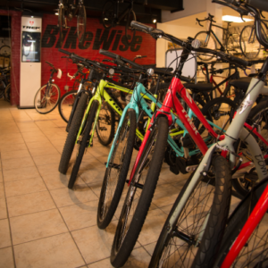 A row of bikes lined up inside Bikewise