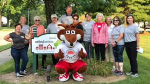 Rox the Fox in a group photo with Oxford Seniors staff.