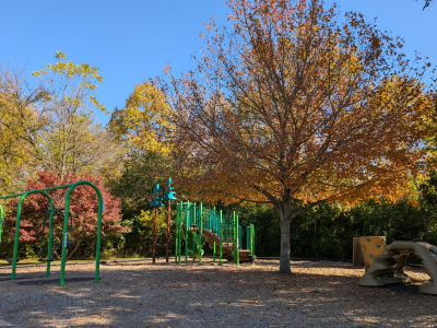 Leonard Howell Park playground with shaded trees