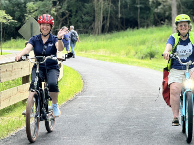 Two people riding their bikes on phase 3 of the Oxford Area Trails