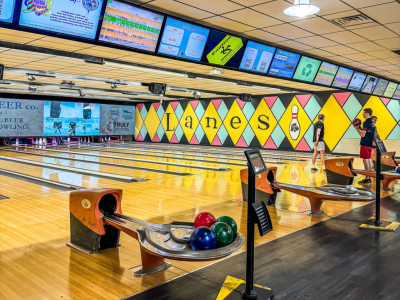 Inside of Oxford Lanes with retro mural