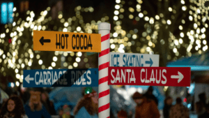 A red and white striped wayfinding pole of event directions