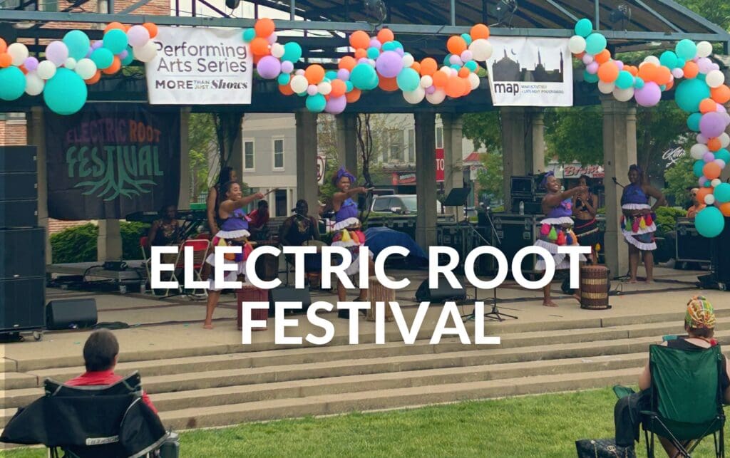 ELECTRIC ROOT FESTIVAL text over a photo of performers on stage