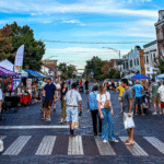 Street market with people walking and shopping.