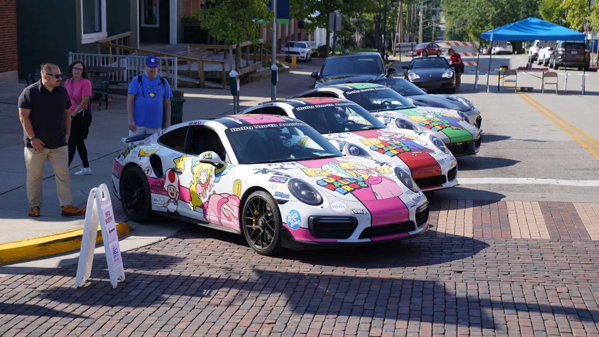 Colorful cars with cartoon-themed designs displayed.