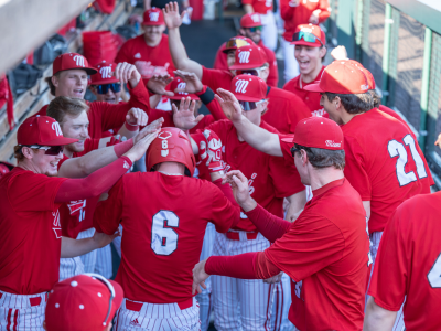 Group of Miami University baseball players in dugout.