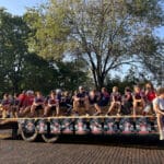 A group of younger football players rides on the back of a truck in the Talawanda High School Homecoming parade.