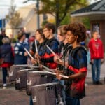 A high school drumline performs on the red bricked streets of Uptown Oxford.