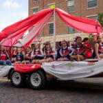 A group of young cheerleaders rides on a float in the Talawanda High School Homecoming parade.