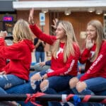 A group of female students ride on a trailer during the Talawanda HS Homecoming parade.