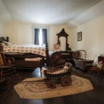 A bedroom filled with pioneer artifacts