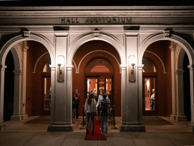 Hall Auditorium exterior building with uplighting on pillars at night