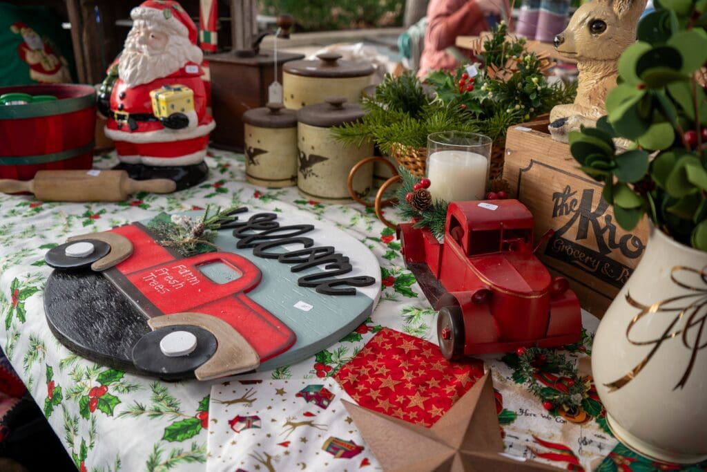Close up of a table filled with festive holiday crafts and decor
