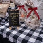 Close up of a vendor's table with gifts for Thanksgiving hosts and hostesses on display