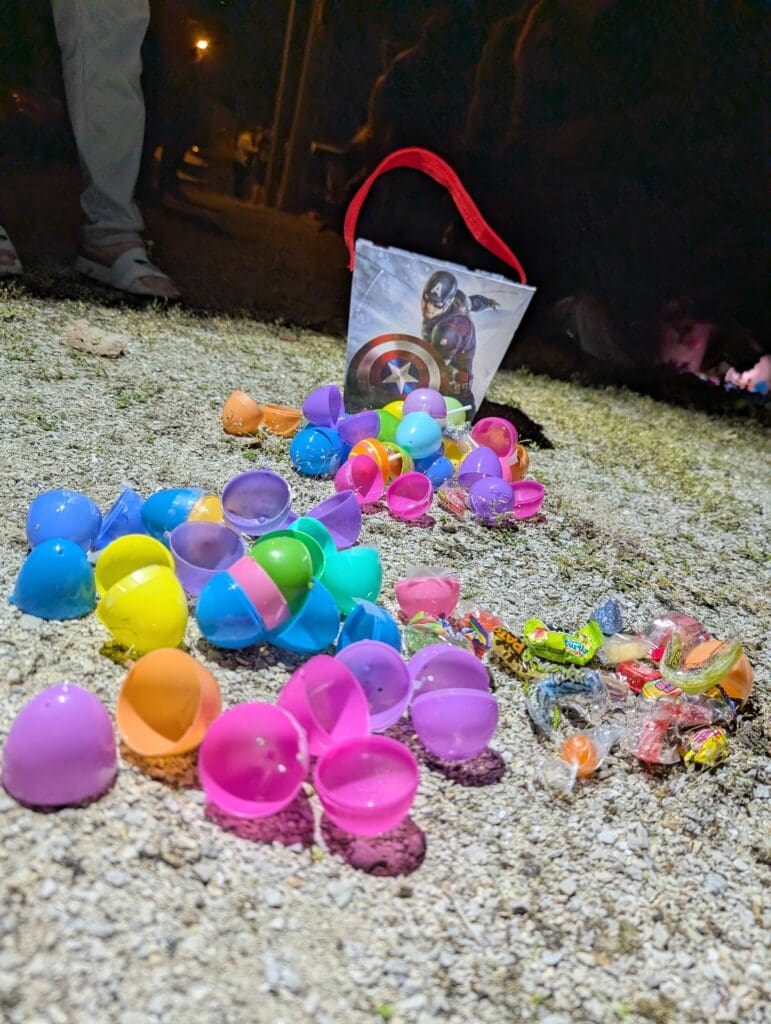 a collection of opened eggs in front of a Captain America basket