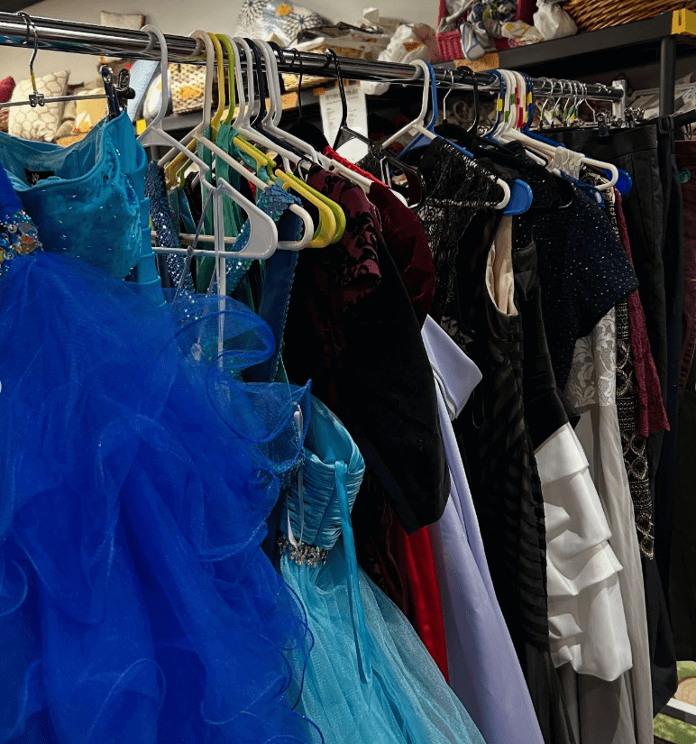 a rack of secondhand formal dresses