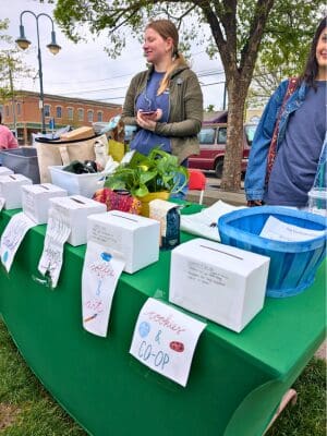 two students managing a raffle booth