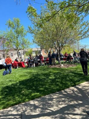 A group of people walking around booths at Dr. Martin Luther King JR. Park