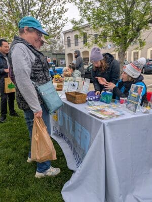 A person talking to Butler County Soil and Water Conservation booth