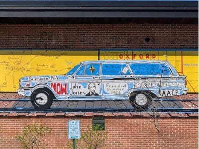 "Changemakers of Oxford" mural shows a photo of the car with names of local Civil Rights activists and events.