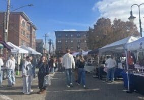 Vendors line the streets of Uptown Oxford as crowds meander from booth to booth.