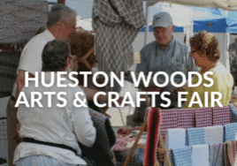 HUESTON WOODS ARTS & CRAFTS FAIR text over a photo of a vendor and shoppers talking at a booth.