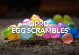 OPRD Egg Scrambles text over top of colorful plastic eggs