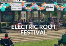 ELECTRIC ROOT FESTIVAL text over a photo of performers on stage