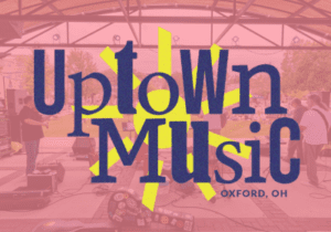 Uptown Music logo over top a band at the pavilion.
